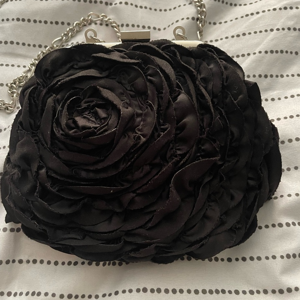 Small purse , great for a going to dinner purse . Will fit cell phone n makeup.